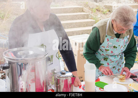 Women`s Institute members making cakes and scones to sell with tea at Festival of Thrift. UK Stock Photo